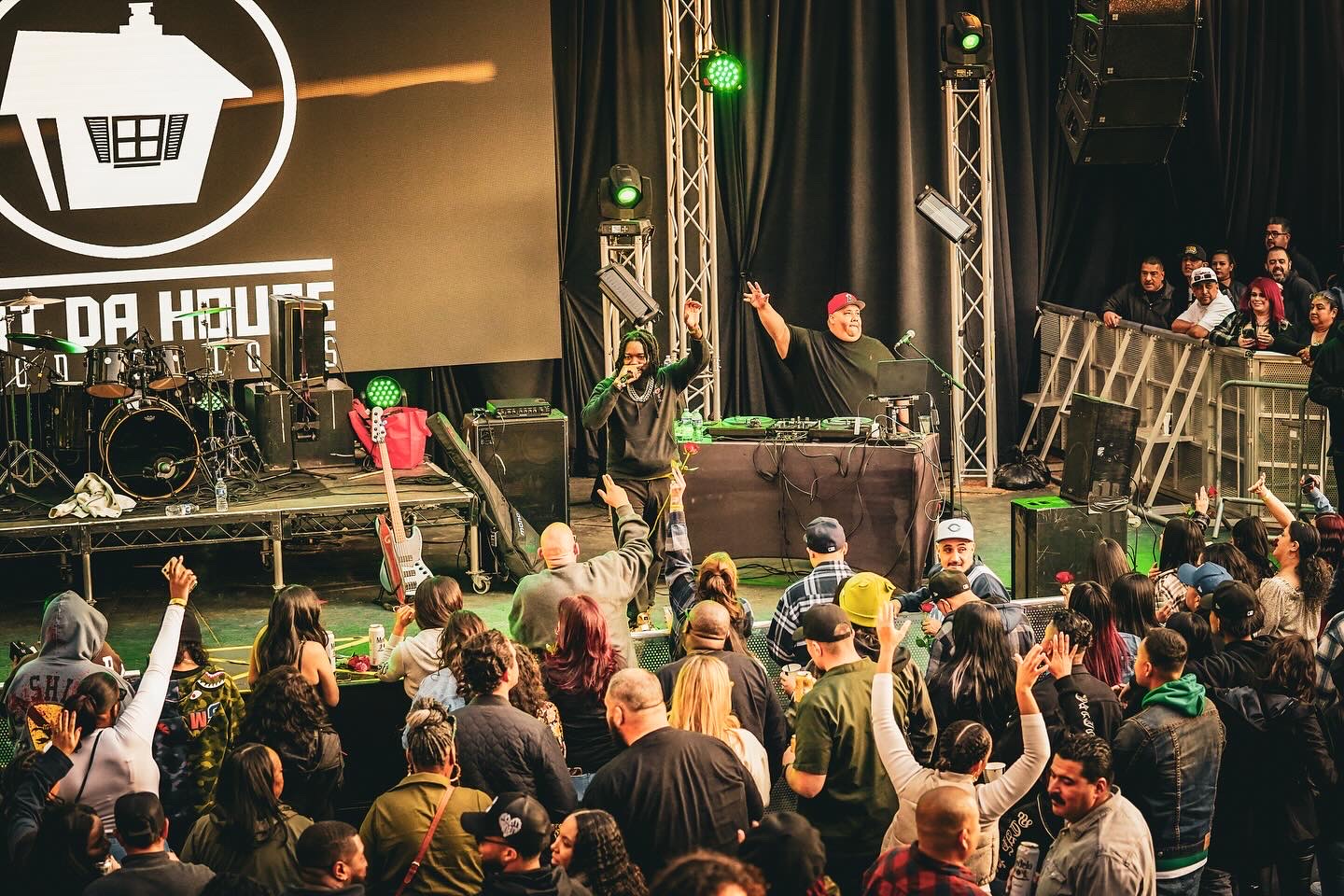 JoethePoet and his DJ performing to a full crowd